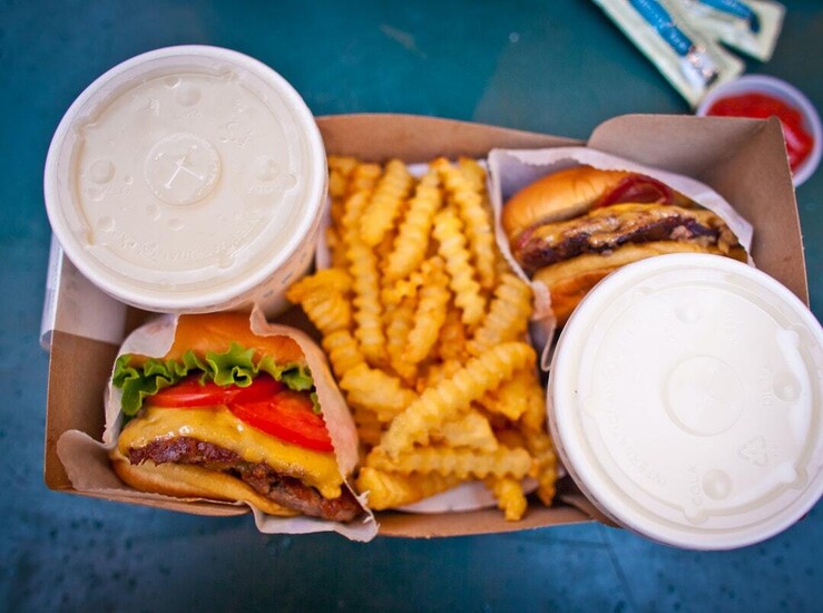 burgers with fries and drinks