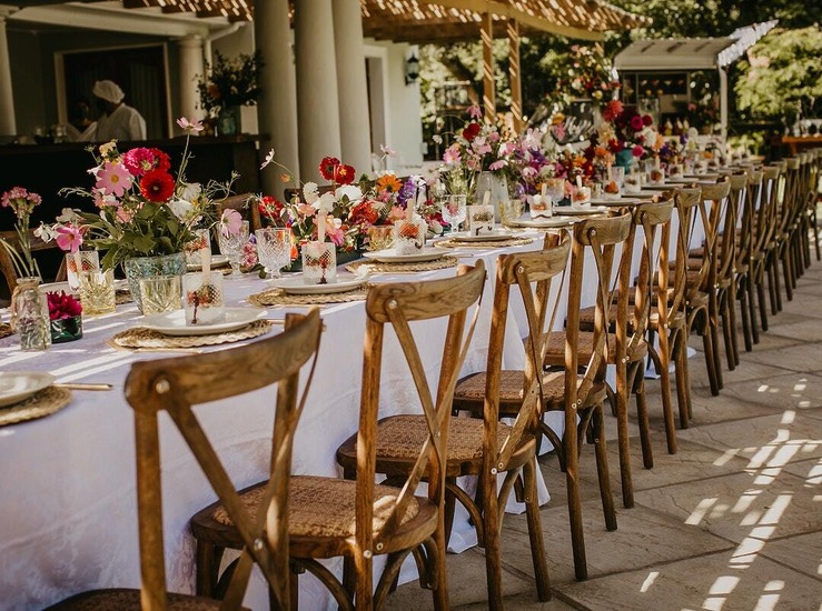 tables with centerpieces and cutlery