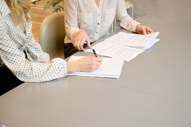 female lawyer signing documents
