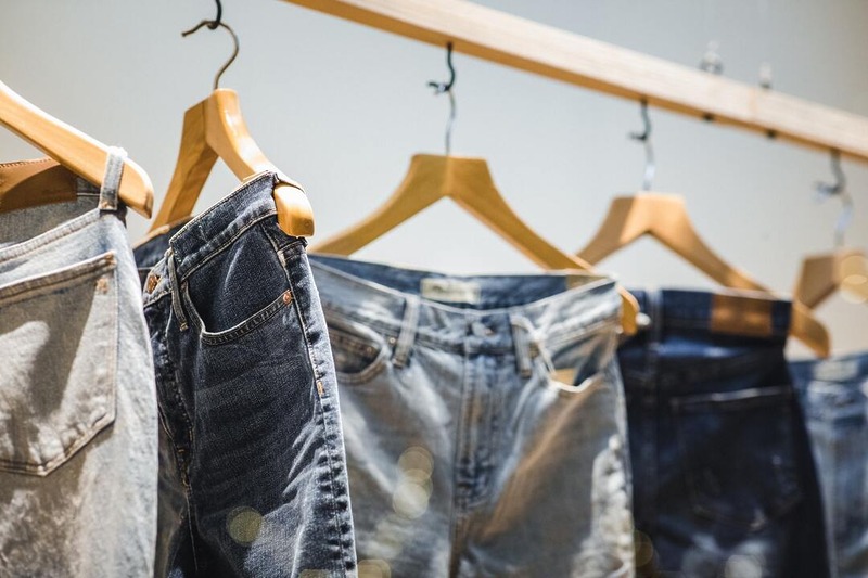Best pages to buy jeans in the USA, Pants hanging on clothes hangers