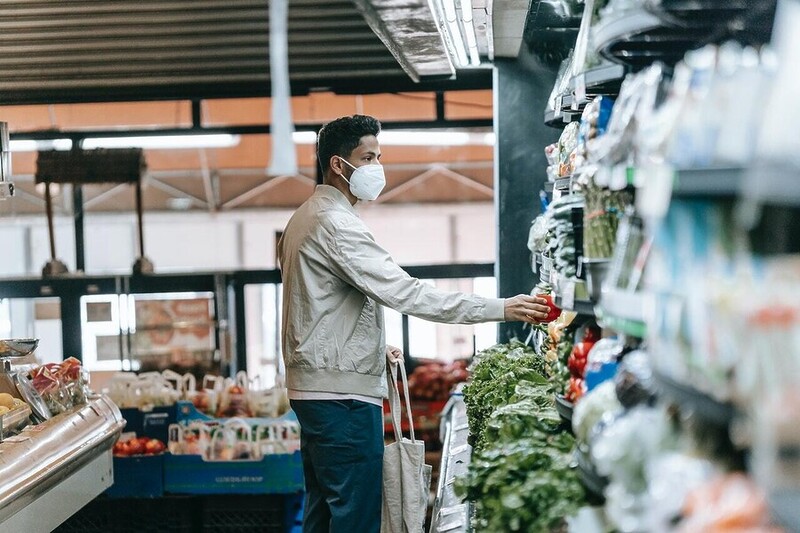 man buying vegetables