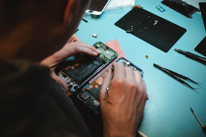 Technician repairing phone
