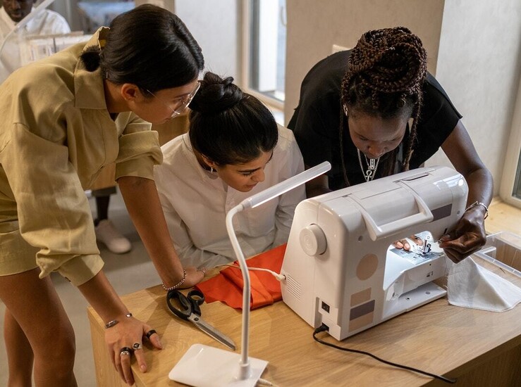 Women using a sewing machine