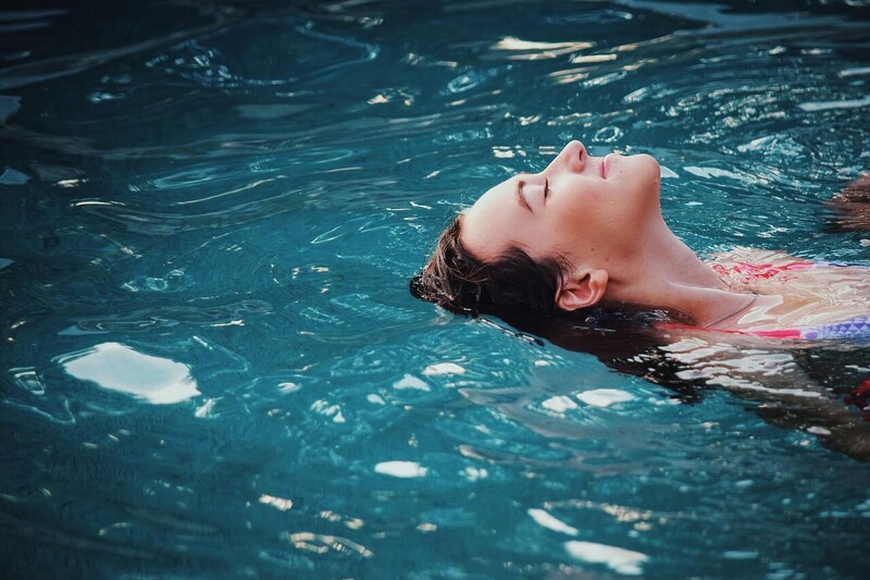 Woman relaxing in thermal water